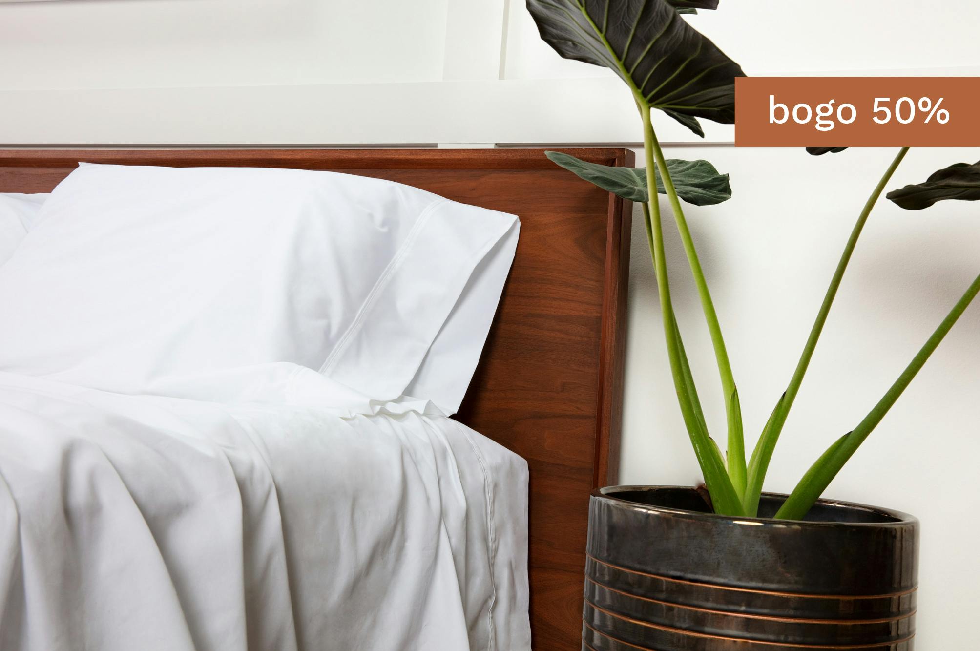 closeup of white sheets on a bed