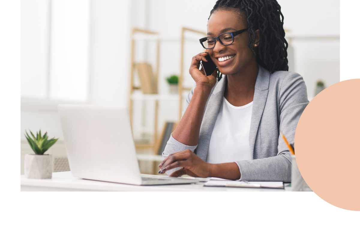 photo of a woman smiling while talking on the phone