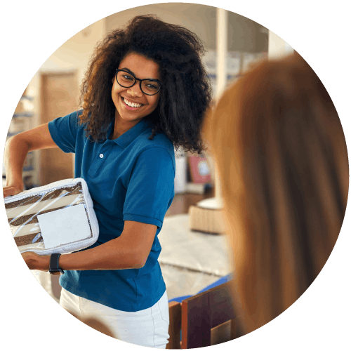 Photo of a sales woman teaching someone about the product