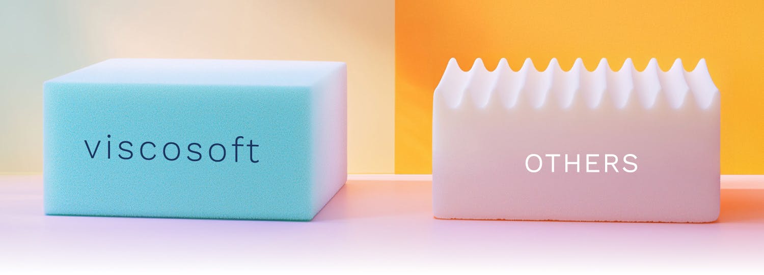 a dense blue block of foam sitting next to a block of white egg crate foam