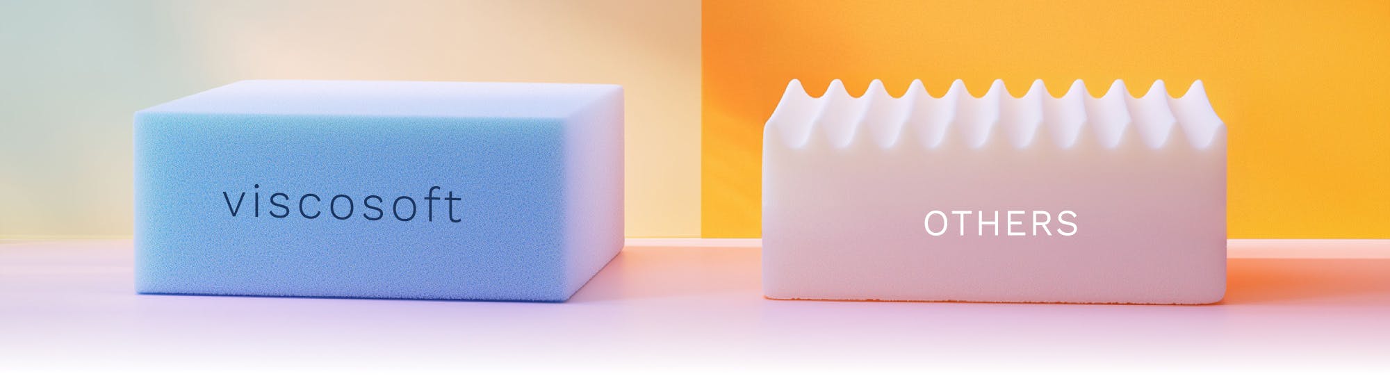 a dense blue block of foam sitting next to a block of white egg crate foam