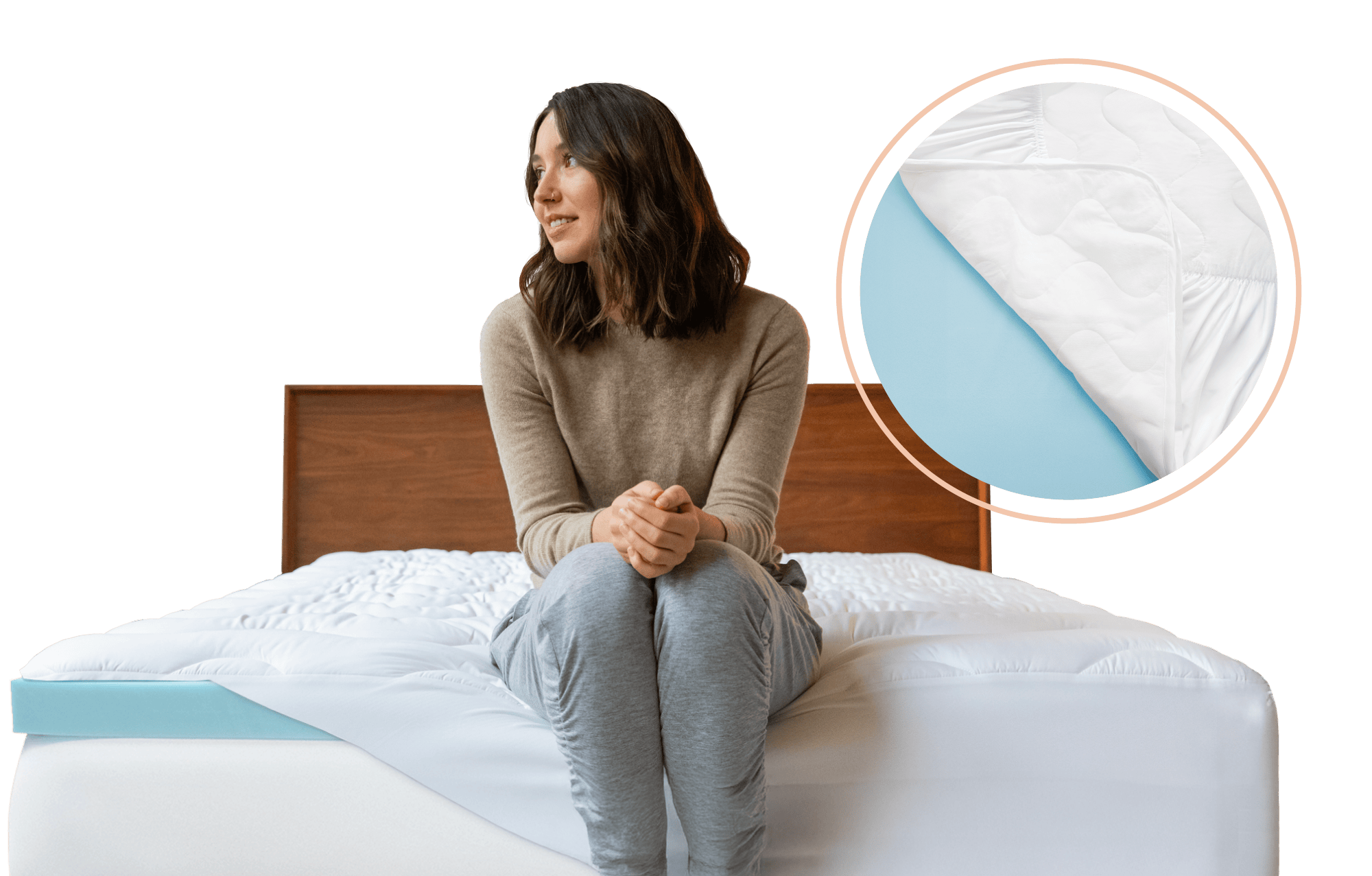 Woman sitting on a bed fitted with a blue memory foam mattress topper and a white lightly padded cover.