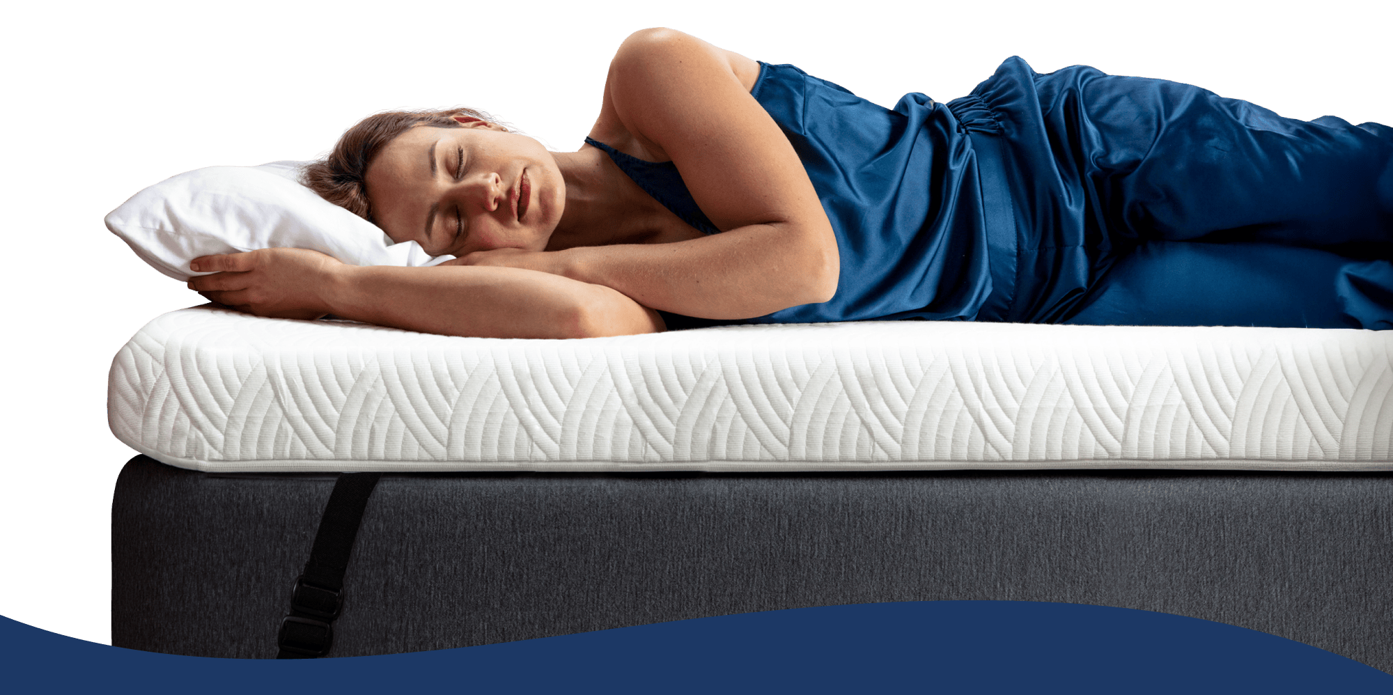 woman sleeping on her side on a thick white mattress topper