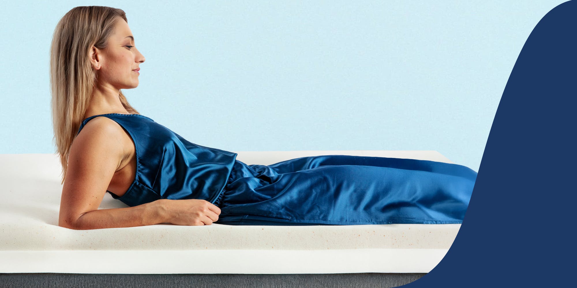 woman sleeping on her side on a thick white mattress topper