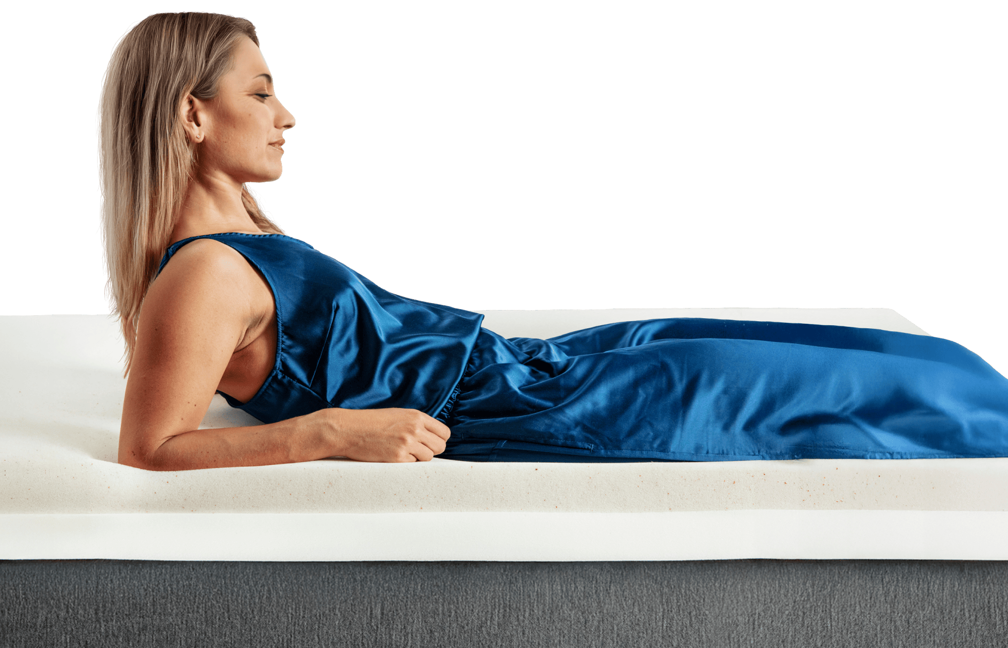 woman sleeping on her side on a thick white mattress topper