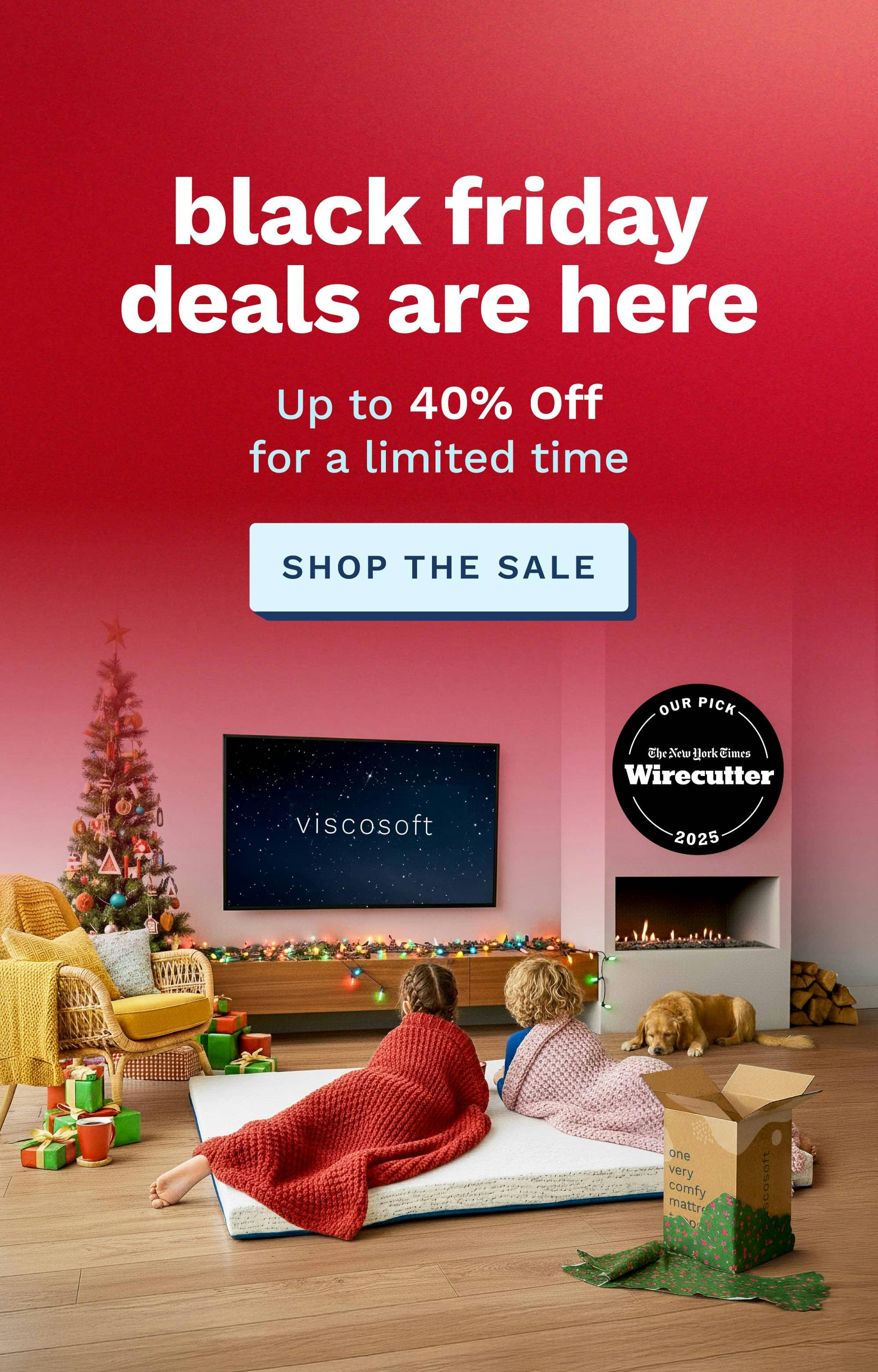 Text that says Black Friday deals are here. Up to 40% Off for a limited time. Imagery of two kids lounging on a mattress topper on the floor of the living room and watching tv.