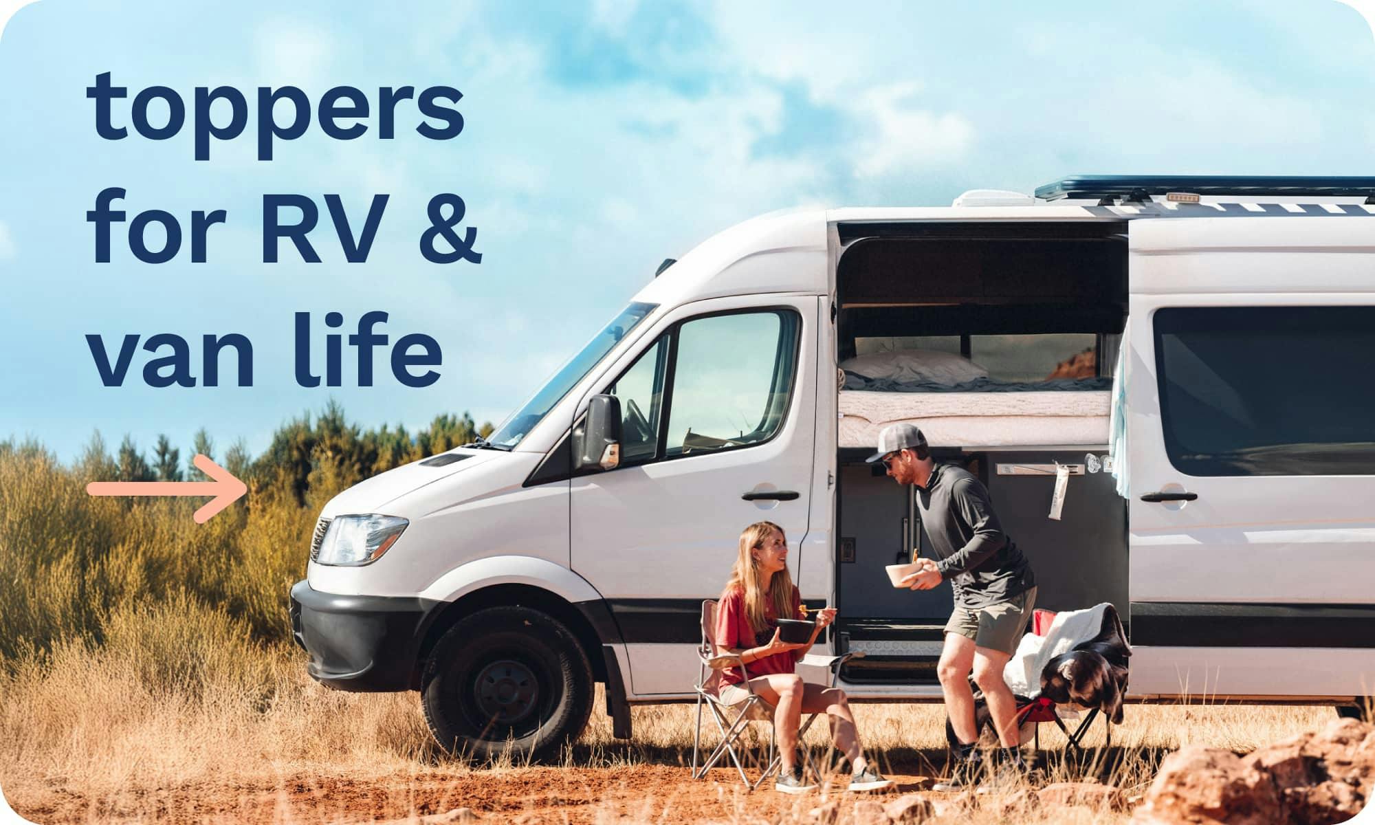 Toppers for RV & Van Life; A young couple sitting in camping chairs outside of their camper van; Camper van has door open showing bed with a mattress topper.