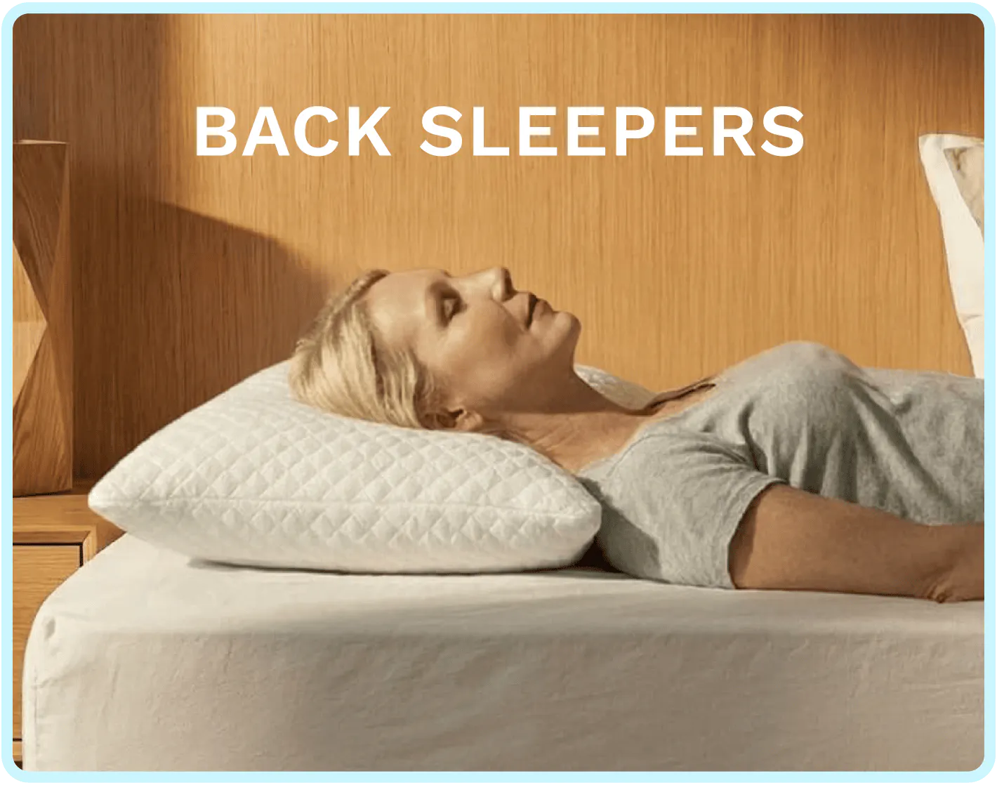 A woman sleeping on her back with a plush white pillow under her head