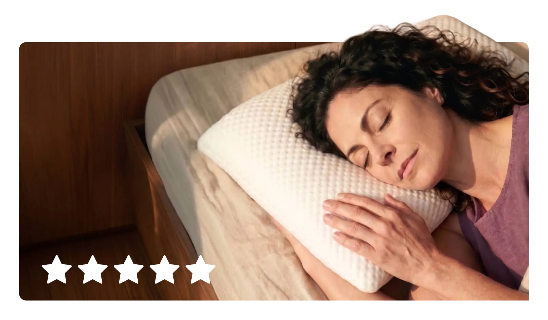 A woman sleeping peacefully on a plush white Viscosoft adjustable pillow.