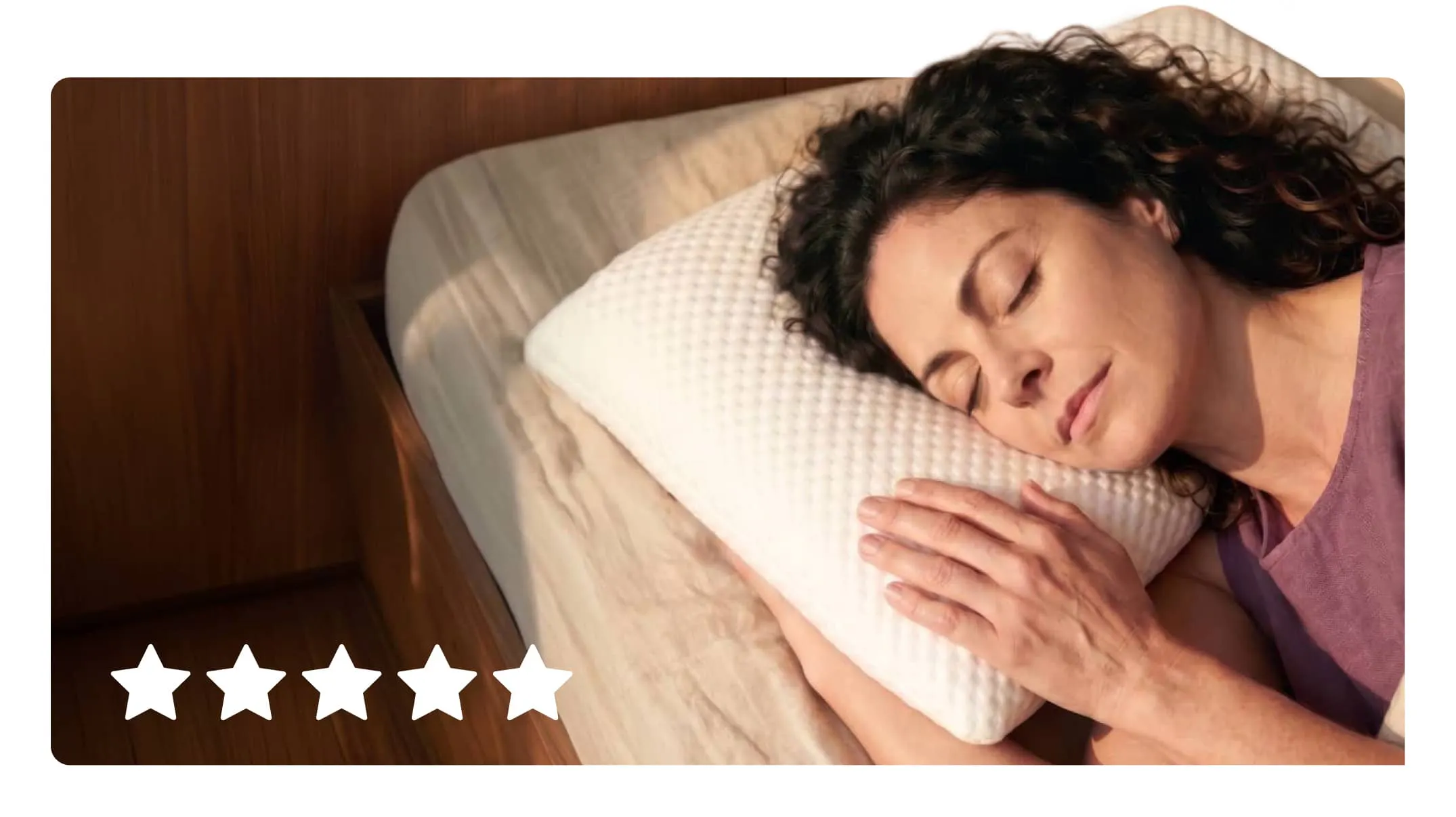 A woman sleeping peacefully on a plush white Viscosoft adjustable pillow.